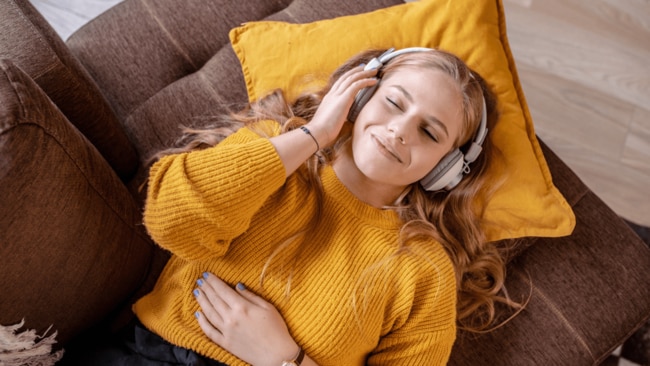 Whether we’re on the train, at the shops, on a walk, at the gym, or at work, we’re listening to music. Image: iStock