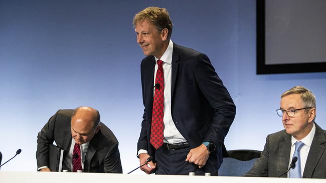 Rio Tinto chief executive Jakob Stausholm, centre, with outgoing chairman Simon Thompson, right, during the company’s AGM in Melbourne on Thursday. Picture: Aaron Francis