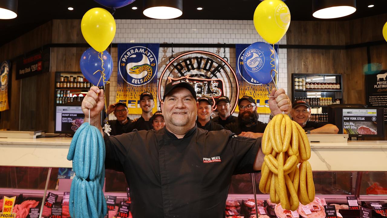 Parramatta Eels diehard and seasoned butcher Manuel Dinoris is rolling out blue and gold chicken sausages for Grand Final week. Picture: Jonathan Ng