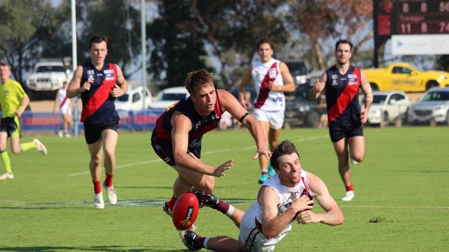 Traralgon's Tye Hourigan and Bairnsdale's Hugh Longbottom fight for the loose ball in their Gippsland league match on Saturday. Picture: Rachel Gaskell