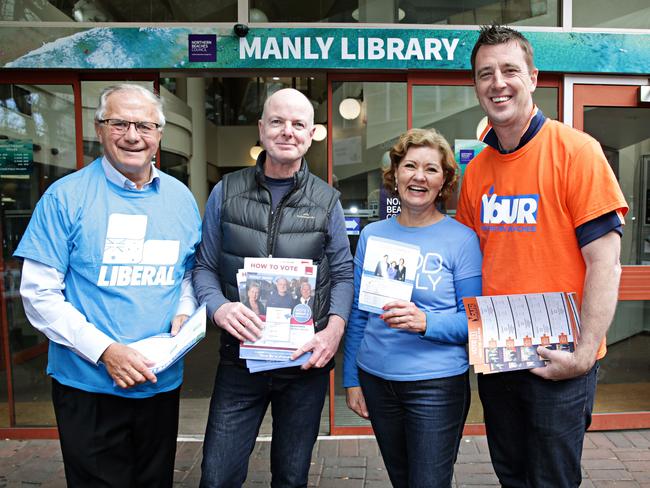 Liberal candidate Pat Daley, Labor candidate, Independent Candy Bingham and Independent Michael Regan handing out how to vote material at Manly Library for pre-polling. Pic: Adam Yip/ Manly Daily