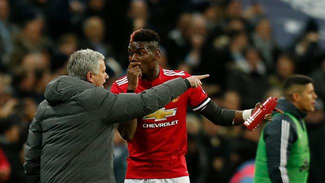 Manchester United's Portuguese manager Jose Mourinho (L) talks with Manchester United's French midfielder Paul Pogba (R)