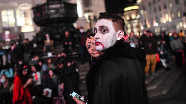 People in fancy dress are seen celebrating Halloween on Saturday night in London. The country is being sent back into lockdown later this week. Picture: Getty Images