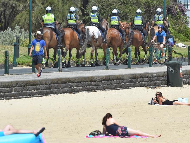 Police put on a show of force at St Kilda beach. Picture: Tony Gough<br/>