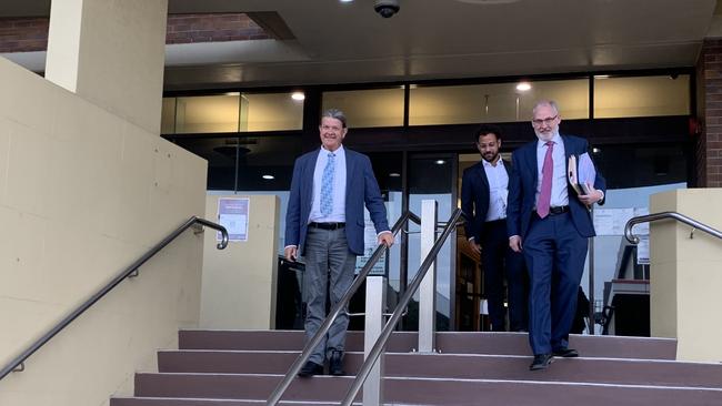 Keith Callinan, barrister Michael de Waard and Macrossan and Amiet managing director Stuart Naylor leave Mackay courthouse.