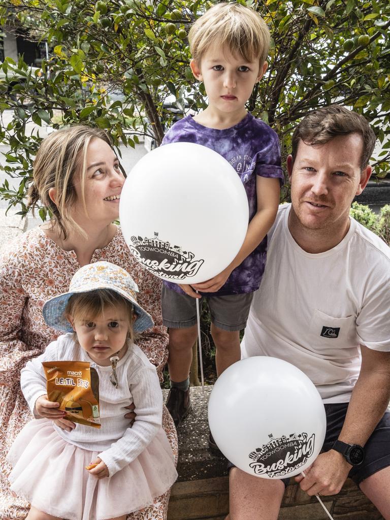 Candice and Jake McGrath with their kids June and Wally watch the performers of the Toowoomba Busking Festival, Saturday, April 29, 2023. Picture: Kevin Farmer
