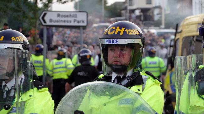 Rows of police face off against the large crowds. Picture: Getty Images