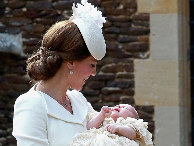 Princess Charlotte also wore the gown as did her younger brother Prince Louis. Picture:  AFP 