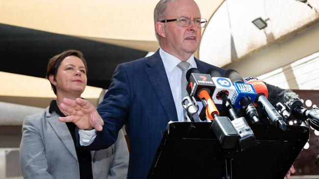 Madeleine King looks on as then opposition leader Anthony Albanese speaks at a press conference at the Kwinana Nickel Refinery in Perth in 2021.