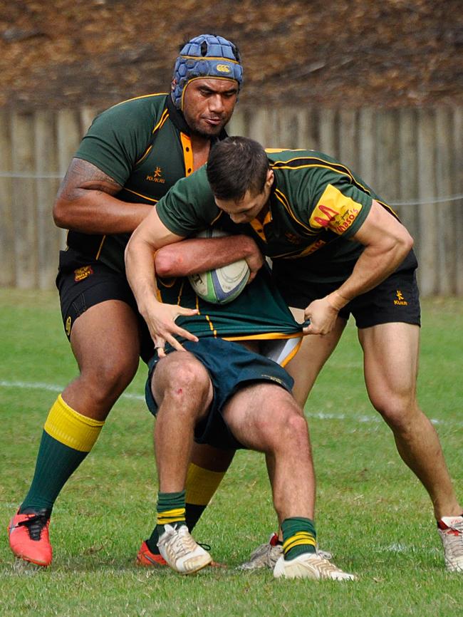 The Eels forward assists in a tackle.