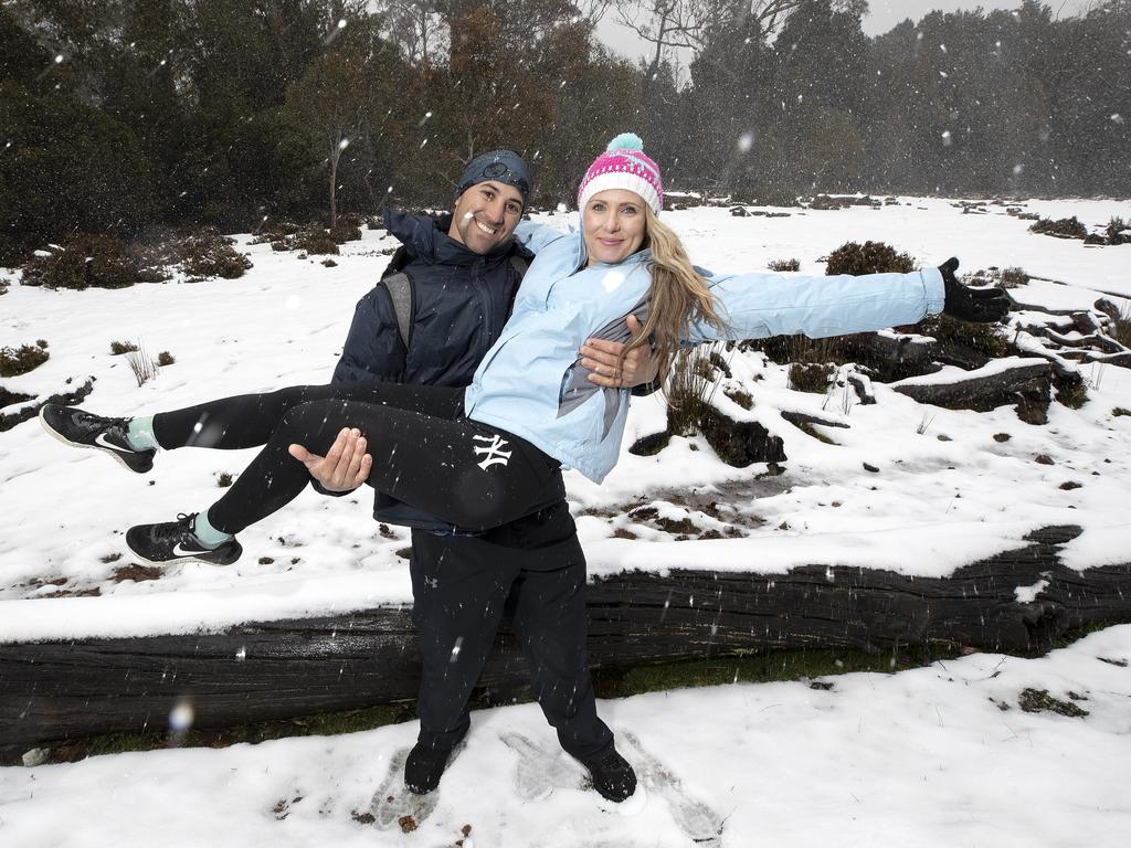 Chris and Michelle Parker of Brisbane enjoy the snow at Cradle Mountain. PICTURE CHRIS KIDD