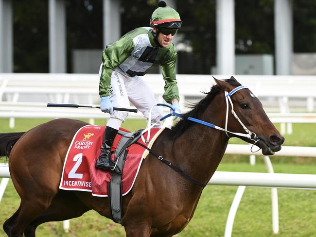 MELBOURNE, AUSTRALIA - OCTOBER 16: Brett Prebble riding Incentivise winning Race 9, the Carlton Draught Caulfield Cup, during Caulfield Cup Day at Caulfield Racecourse on October 16, 2021 in Melbourne, Australia. (Photo by Vince Caligiuri/Getty Images)