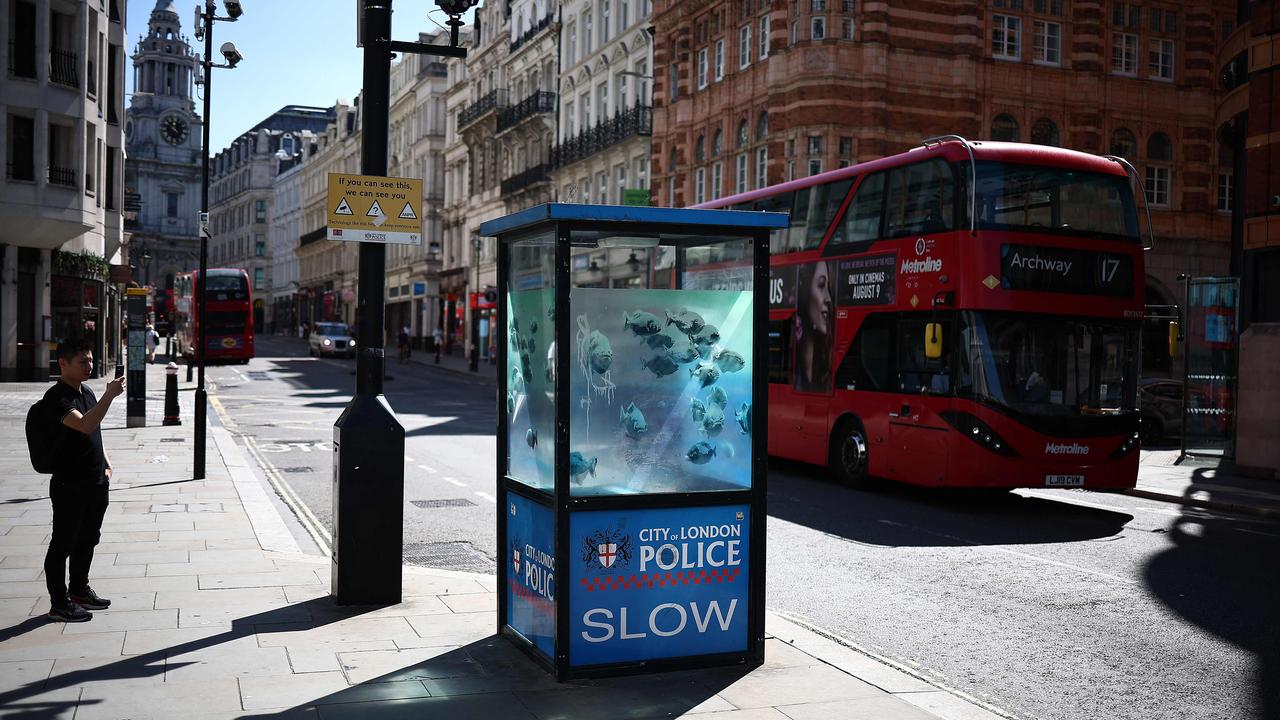 Banksy turned this police sentry box into a fish tank using translucent paint. Picture: Henry Nicholls/AFP