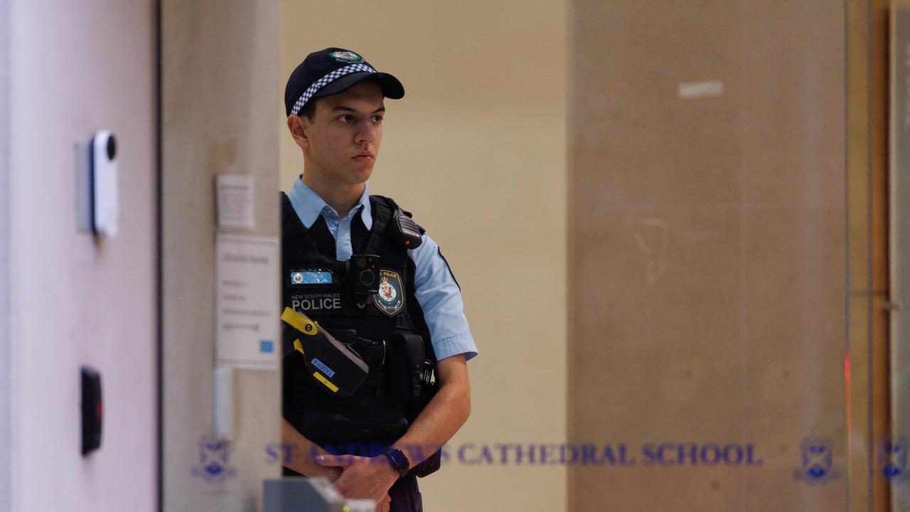 An officer standing inside the school as the investigation gets underway. Picture: NCA NewsWire / David Swift