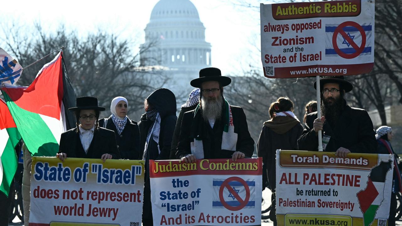 Members of the anti-Zionist Jews group Neturei Karta join pro-Palestinians people blocking a street. Picture: AFP