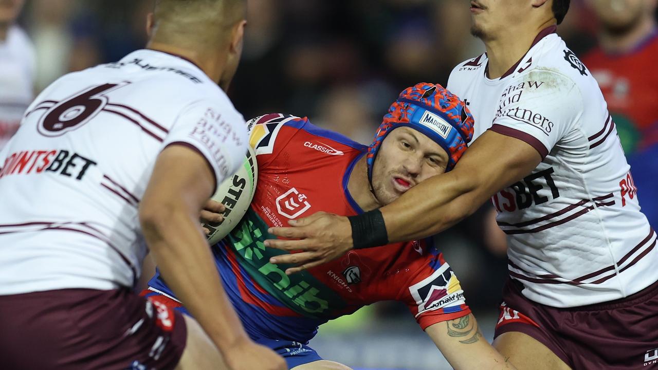 NEWCASTLE, AUSTRALIA - MAY 28: Kalyn Ponga of the Knights is tackled during the round 13 NRL match between Newcastle Knights and Manly Sea Eagles at McDonald Jones Stadium on May 28, 2023 in Newcastle, Australia. (Photo by Scott Gardiner/Getty Images)