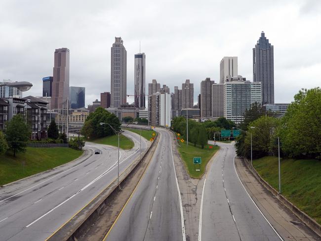 A lone car is seen on the highway leading to the city of Atlanta during the novel coronavirus pandemic in Georgia. Many streets are empty, and have been empty, since stay-at-home orders came into effect. Picture: Tami Chappell/AFP