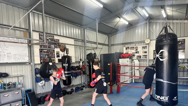 Glenorchy Boxing Club members Charlie Gregson (front left), Tyler Wordsworth (front right) and Connor Flakemore (back) train ahead of a pro-am on the Gold Coast. Picture: Ryan Rosendale.