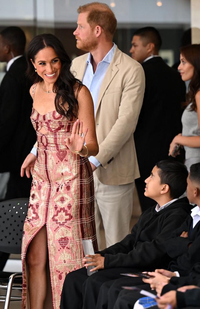 Britain's Prince Harry Duke of Sussex, and Meghan Markle greet students during a visit to the National Centre for the Arts in Bogota. Picture: RAUL ARBOLEDA/AFP