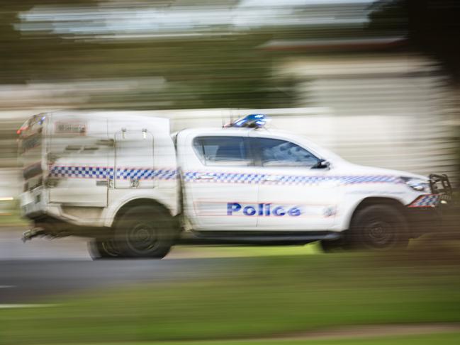 A police vehicle under lights and sirens on Ruthven St in Toowoomba, Wednesday, April 24, 2024. generic Queensland Police, QPS, police Picture: Kevin Farmer