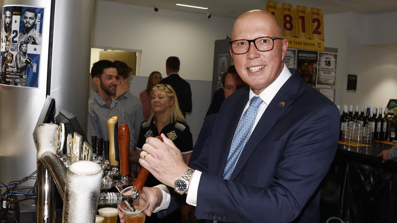Mr Dutton won back the crowd’s favour after pouring a few beers. Picture: Richard Dobson / Newswire