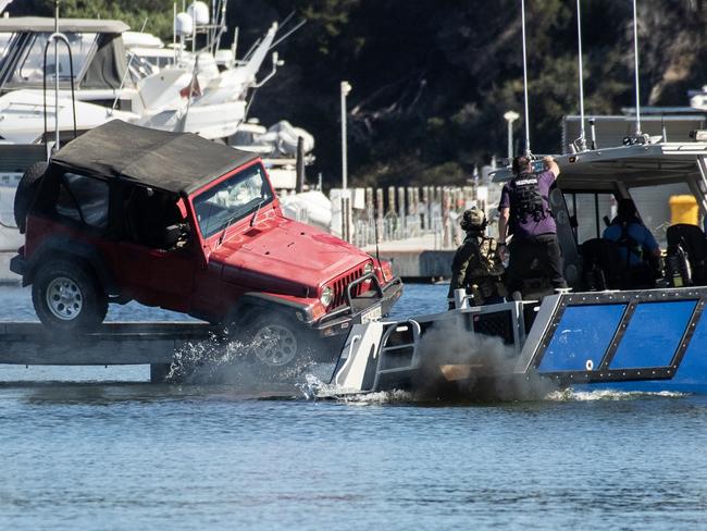 PERTH, AUSTRALIA - NewsWire Photos- APRIL 30, 2025. Claremont Jetty Stand Off: A man was arrested today after a stand off on Claremont Jetty involving a jeep. The man drove the car off the jetty in the direction of a police boat. He escaped the vehicle and was then arrested. Picture: Michael Wilson/ The West Australian/ NewsWire