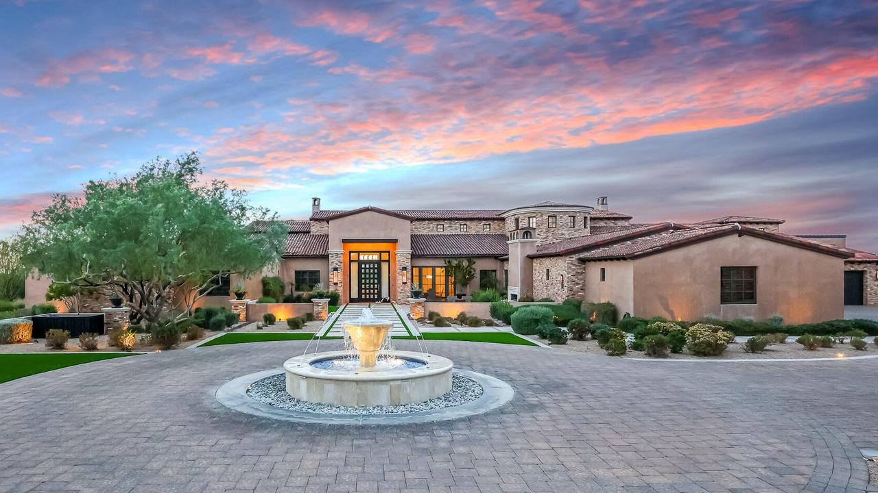 A fountain greets you as your pull up to your front door. Pictures via David Newman Partners