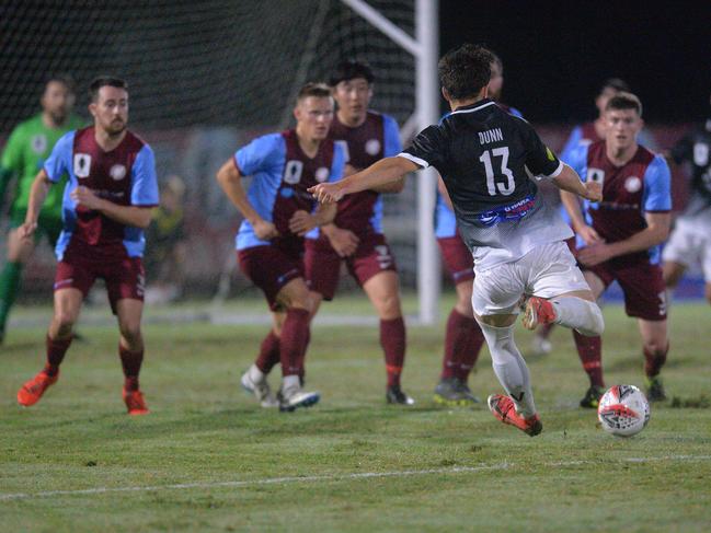 Coomera players in action against Mackay and Whitsundays in the FFA Cup.