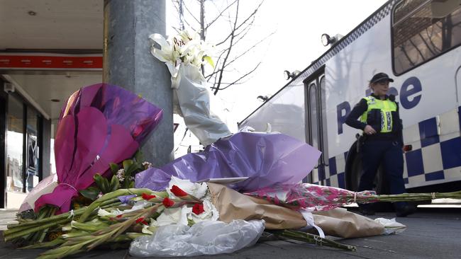 Tributes lay near where Voula Delios was killed. Picture: KIM EISZELE