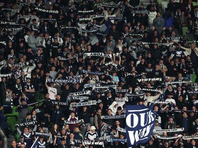 MELBOURNE, AUSTRALIA - APRIL 27:  Victory supporters hold up their scarves in the crowd during the A-League Men round 26 match between Melbourne Victory and Western Sydney Wanderers at AAMI Park, on April 27, 2024, in Melbourne, Australia. (Photo by Robert Cianflone/Getty Images)