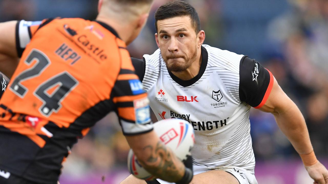 Toronto Wolfpack's New Zealand player Sonny Bill WIlliams tackles Castleford's Tyla Hepi.