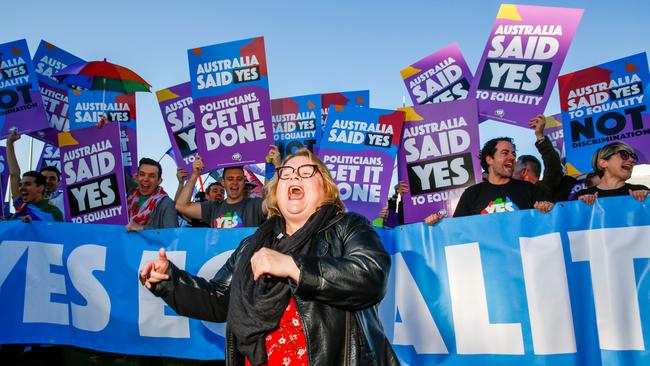 Magda Szubanski dances in front of quality ambassadors and volunteers from the Equality Campaign in front of Parliament House in Canberra. Picture: AFP.