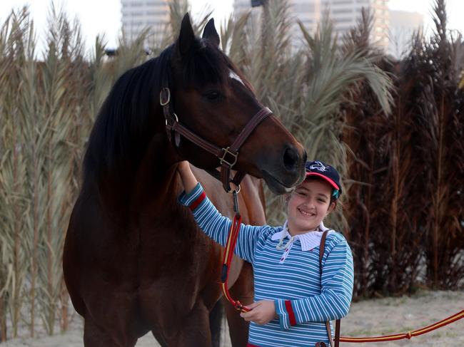 Dr Amad Ashaad's daughter Dania with Eavesdropper, one of the horses that was kidnapped.