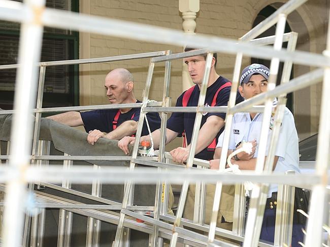 Firefighters at the ready behind the makeshift coral. Picture: John Appleyard