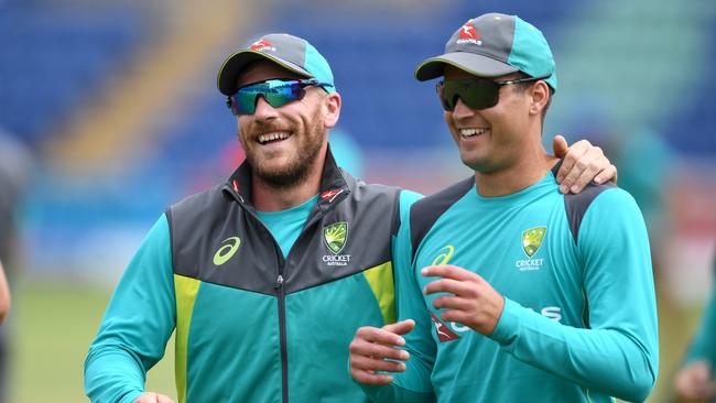 Aaron Finch and Marcus Stoinis share a joke during training.