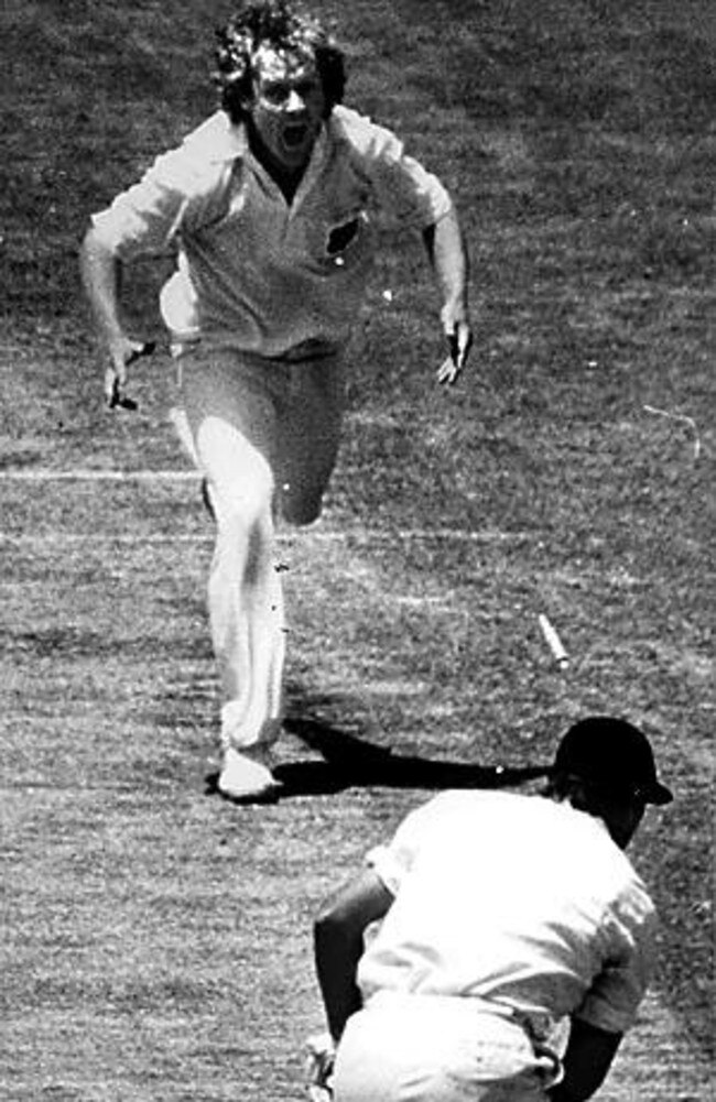 Rodney Hogg shouts for joy as English opener Geoff Boycott has his middle stump lifted.