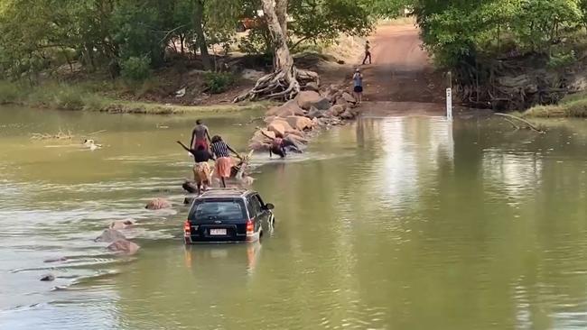 A group of people stranded on Cahills Crossing had to rock hop across the notorious body of water to escape. Picture: Supplied