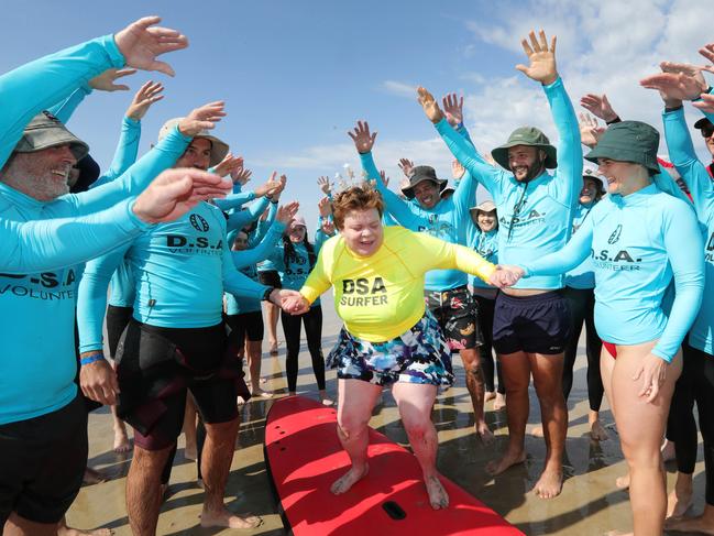 Ocean Grove Disabled Surfers Association is holding one of its two annual events where more than 100 volunteers hit the water to assist people with disabilities get a safe ride in the surf.Birthday and Surfer girl Kate Nolan with volnteersPicture: Mark Wilson