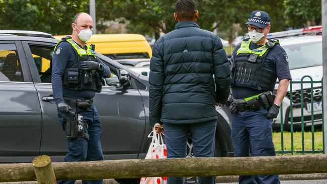 A man arrives to deliver groceries to a family in Flemington. Picture: Asanka Ratnayake/Getty Images