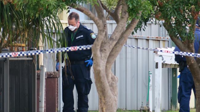 Forensic police are on the scene of the fatal shooting at Queen St, Stockton. Picture: Emily Burley.