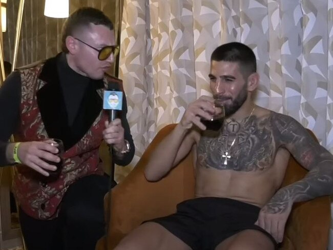 Topuria sips a glass of red wine with MMA media personality The Schmo. Picture: YouTube/The Schmo