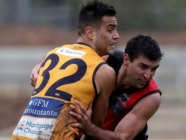 Strathmore’s Athan Tsialtas battles with Luke Foster this year. Picture: Mark Dadswell