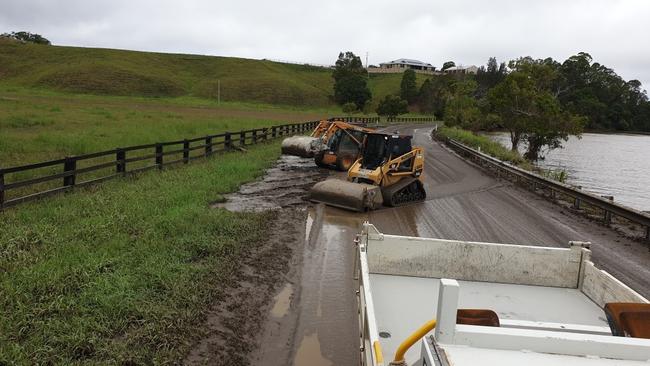 Tweed Shire Council workers have been working to clean up Dulguigan Rd in North Tumbulgum after floodwaters receded.