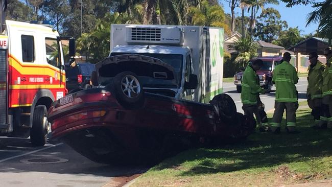 A man has been injured when his car rolled on Central St, Arundel this morning. Photo: Jessica Elder