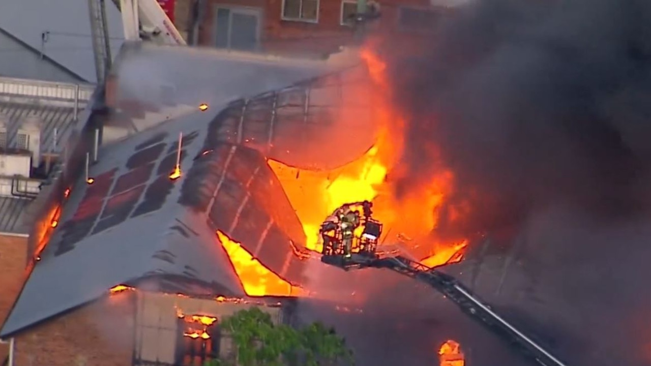 A man has been rushed to hospital with life threatening injuries after an inner city building became engulfed in flames. Picture: 9NEWS