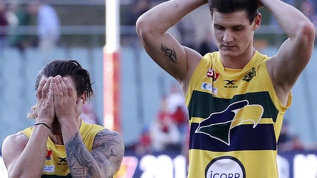 Eagles James Boyd and Luke Thompson stand in disbelief after the loss to North Adelaide in last week’s preliminary final. Picture: Sarah Reed