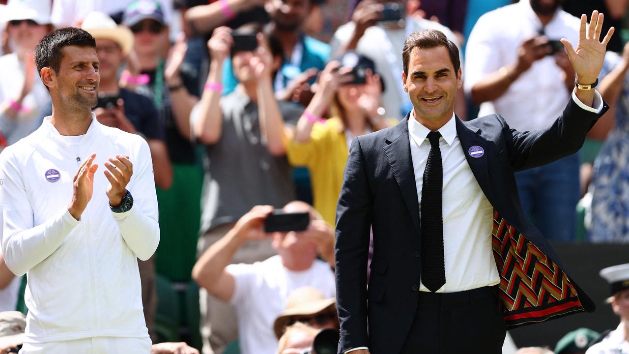 Novak Djokovic and Roger Federer at Wimbledon last year. (Photo by Adrian DENNIS / AFP)