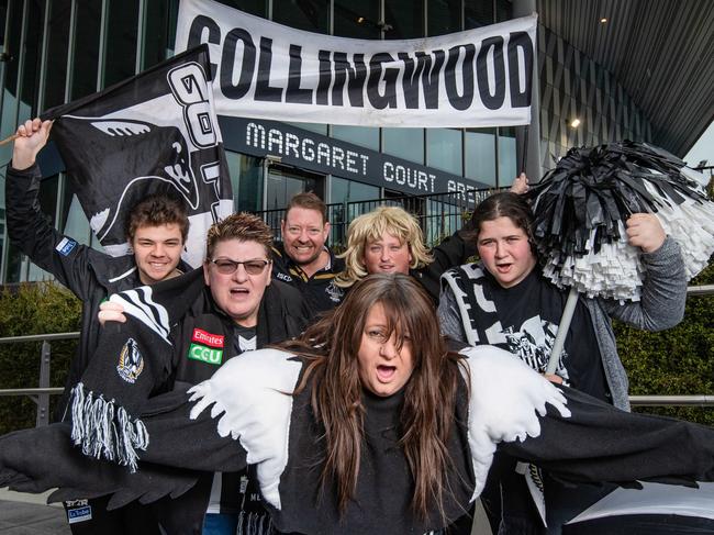 L-r Joshua, Debbie, Clay, Voula, Daniel and Naomi from the Collingwood cheer squad members in front of Margaret Court Arena where a Pies fan zone will be set up for Friday night's game. Picture: Jason Edwards