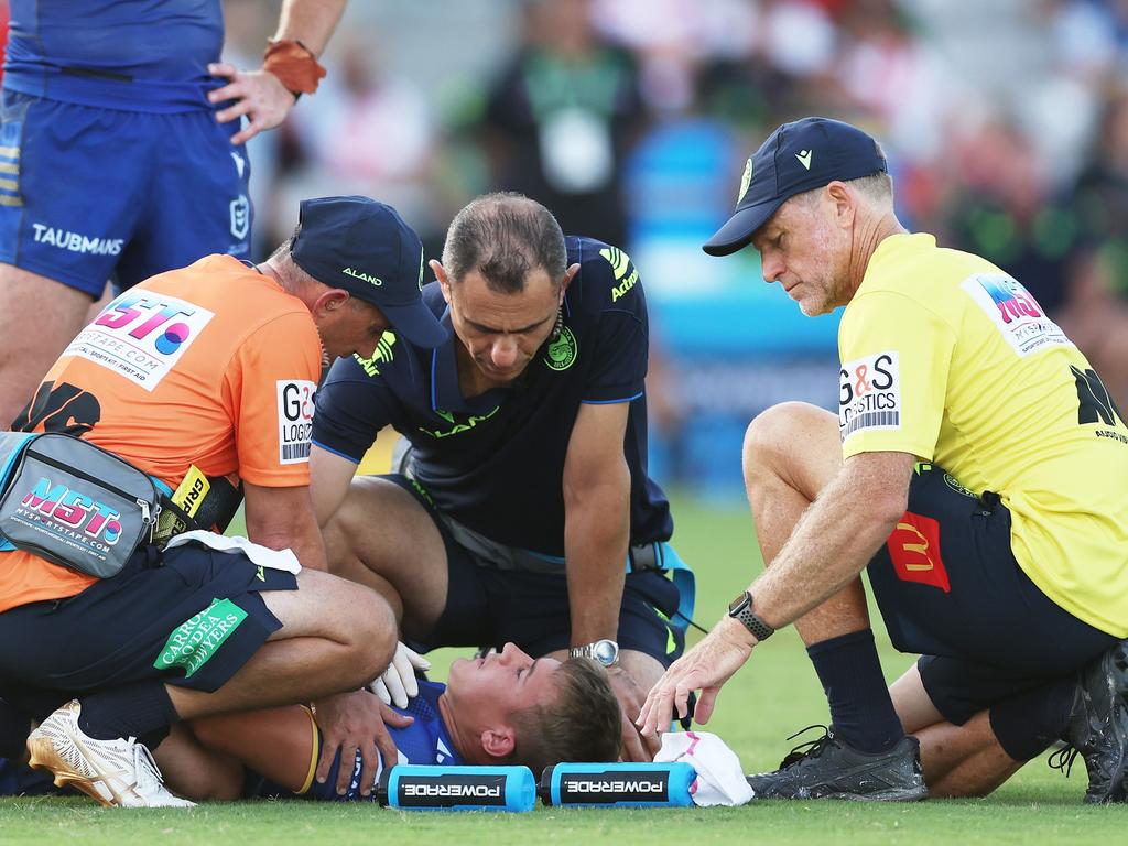 Matthew Arthur is assisted by trainers and doctors after a sickening collision. Picture: Matt King/Getty Images