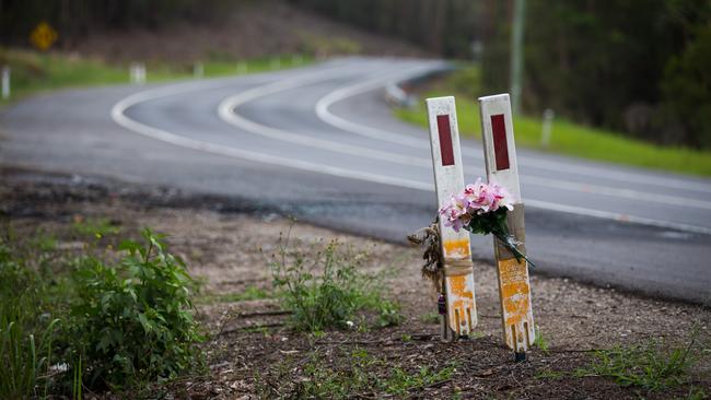 A floral tribute to victims of a country road crash.